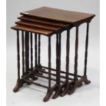 An early 20th century mahogany quartetto nest of tables with satinwood crossbanded borders, raised