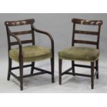 A set of eight George IV mahogany bar back dining chairs with padded seats, raised on square