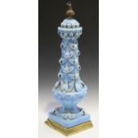 A 20th century turquoise glazed ceramic table lamp with overall applied leaf mounts, height 70cm (