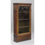 A 19th century and later pine bookcase, fitted with a single glazed door, height 190cm, width