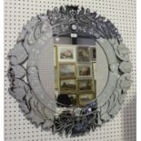 A modern Venetian style circular sectional wall mirror with etched floral decoration, diameter