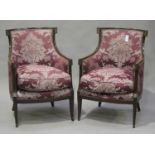 A pair of 20th century French Empire style mahogany framed armchairs, on square tapering sabre legs,