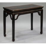 A late 19th century Chinese softwood side table, the rectangular top raised on block legs, height