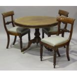 An early 19th century mahogany tip-top supper table, the circular top raised on a turned and