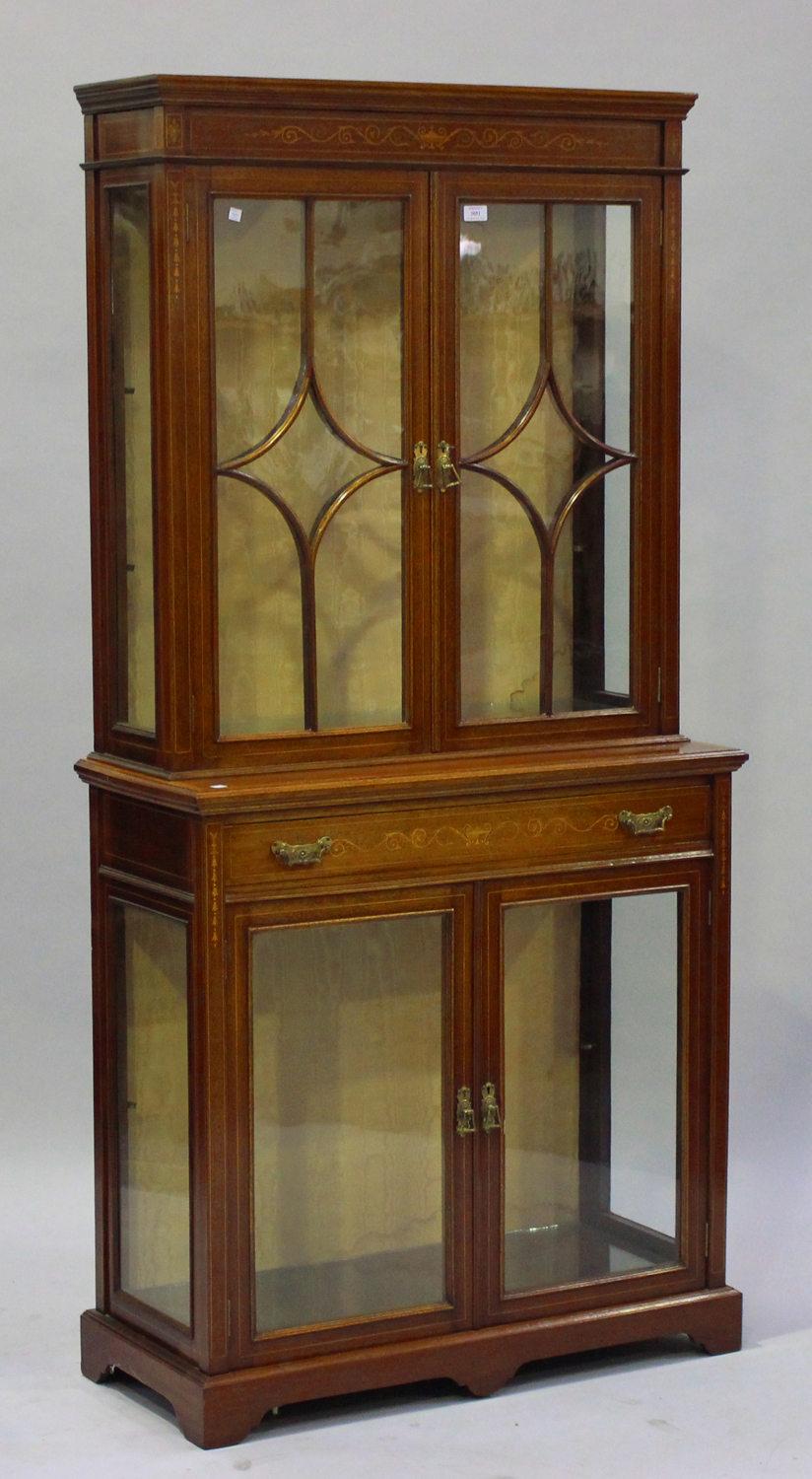 An Edwardian mahogany display cabinet by James Shoolbred & Co with inlaid decoration, the moulded