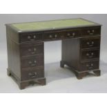 A 20th century reproduction twin pedestal desk, fitted with an arrangement of drawers, height