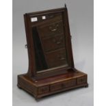 A 19th century mahogany swing frame toilet mirror with crossbanded and line inlaid decoration, the