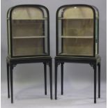 A pair of late 19th century ebonized and gilt metal mounted display cabinets, each domed top above a