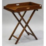 A 19th century mahogany butler's tray and folding stand, height 82cm, width 71cm, depth 45cm.Buyer’s