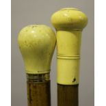 An early 19th century Malacca sword stick with a carved ivory handle, yellow metal mounts and a