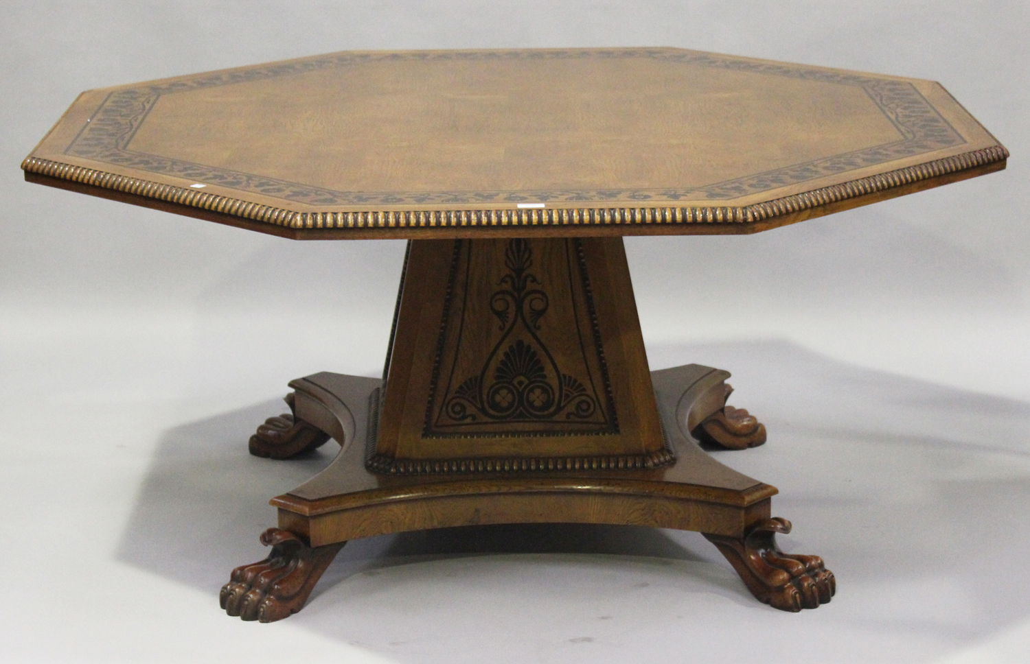 A Regency style reproduction oak and ebony inlaid centre table, in the style of George Bullock,