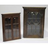 A 19th century oak hanging corner cabinet, the moulded pediment above an astragal glazed door