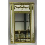 A 20th century French Louis XVI style gilt and white painted pier mirror, the frieze decorated