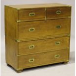 A late 19th/early 20th century teak campaign chest with brass recessed mounts and handles, fitted