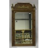An early 20th century French fruitwood pier mirror with gilt metal mounts and bevelled glass,