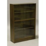 A mid/late 20th century teak glazed bookcase, height 113cm, width 77cm, depth 24cm.Buyer’s Premium