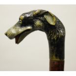 A late 19th/early 20th century walking stick handle, finely carved and painted in the form of a