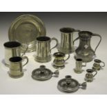 A small group of mainly 19th century pewter, including a plate with London touch marks, diameter