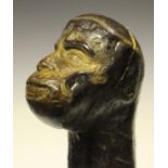 An early 20th century blackthorn shillelagh, carved with a monkey face, length 60cm.Buyer’s