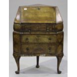 An early 20th century Queen Anne style walnut corner bureau with crossbanded decoration, the fall