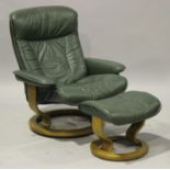 An Ekornes 'Stressless' green leather armchair and matching stool, height 98cm, together with a