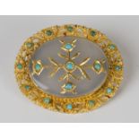 An Asian gold, turquoise and chalcedony oval brooch, the oval chalcedony mounted with floral
