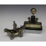 An Edward VII silver mounted desk paperweight, the ebonized plinth supporting a silver ball