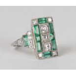 A platinum, emerald and diamond panel shaped ring, mounted with circular cut and baguette cut