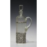 A late 19th century Dutch silver mounted clear faceted cut glass decanter and stopper, the body