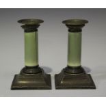 A pair of late Victorian silver and green stained ivory candlesticks, each with detachable nozzle