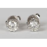 A pair of 18ct white gold and diamond earstuds, each claw set with a circular cut diamond, with post