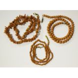 A single row necklace of sixty-nine graduated coral beads, gross weight 16.7g, length 34.5cm,