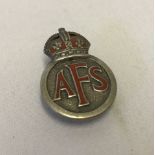 A sterling silver Auxiliary Fire Service lapel badge.