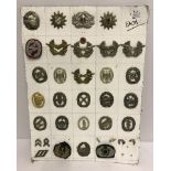 A collection of 29 West and East German military badges and insignia.
