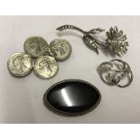 4 vintage silver brooches.
