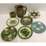 A quantity of vintage majolica plates together with a butter dish and Govancraft rope jug.