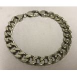 A silver curb bracelet.