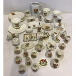 A box of crested ware china.