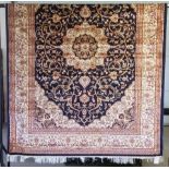 A large Keshan Carpet with blue coloured background design.