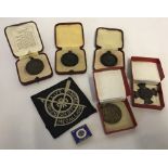 A collection of Royal Life Saving Society medals and badges.