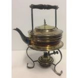 A Mappin & Webb silver-plated spirit kettle with wooden handle and stand.