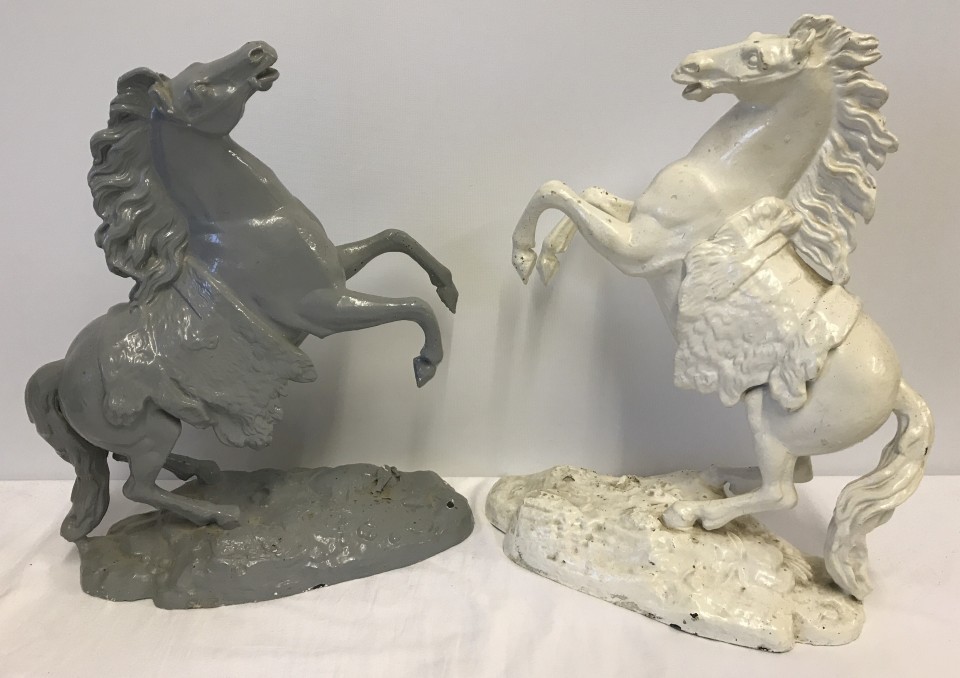 2 vintage spelter rearing horse figurines, one painted cream, one grey.