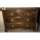 An antique mahogany 2 over 2 chest of drawers with walnut veneered draw fronts.