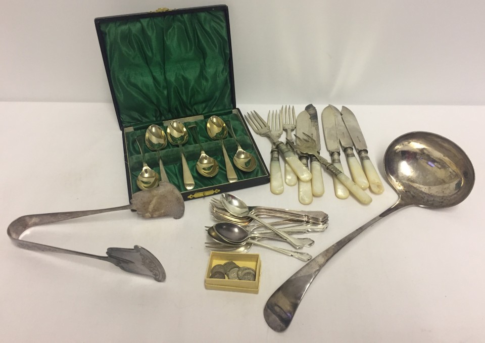 Box of assorted silver-plated cutlery together with 11 three-pence coins.