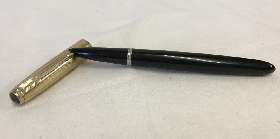 A Parker 51 fountain pen with 12k gold filled cap.