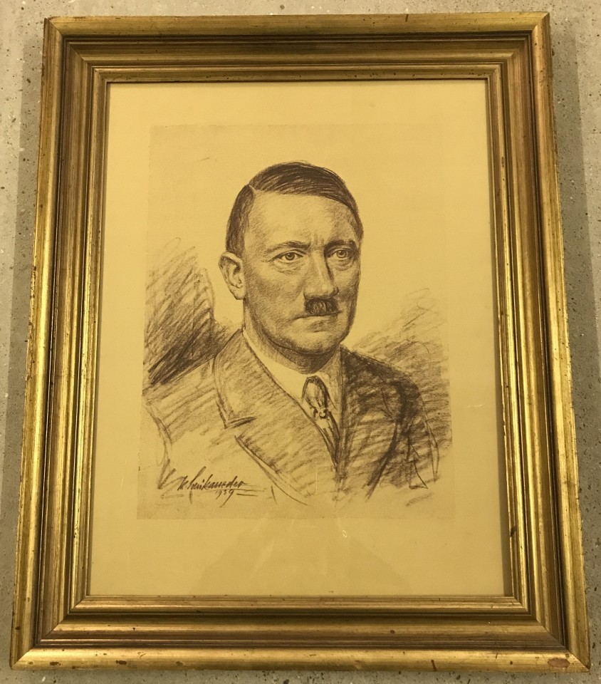 A large print of a pastel drawing of Adolf Hitler.