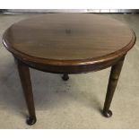 Small mahogany circular coffee table with cabriole legs.