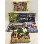 6 boxed 1,000 piece jigsaw puzzles of rural towns and villages.