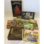 A box of assorted children's vintage boxed jigsaw puzzles.