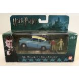 A boxed Corgi Mr. Weasley's Ford Anglia with Harry potter and Ron Weasley figures.